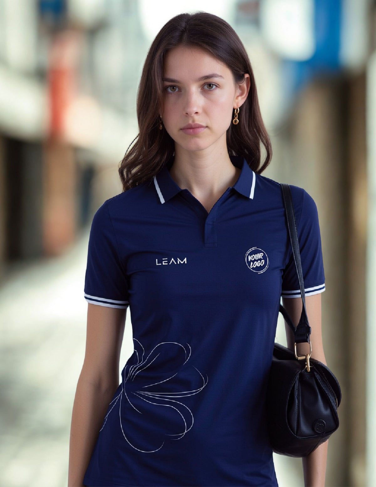 A woman wearing a navy blue short-sleeve polo shirt with white trim and flower pattern on the side, suitable for corporates in Singapore